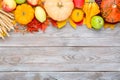 Assorted raw organic fresh vegetables and fruits on wooden table. Fresh garden vegetarian food. Autumn seasonal image of farmer Royalty Free Stock Photo