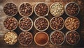 Assorted raw and roasted coffee beans in small brown individual containers on a wooden table Royalty Free Stock Photo