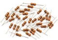 Assorted resistors displayed in a scattered arrangement on a plain background Royalty Free Stock Photo