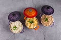 Assorted risottos on gray background. Cheese risotto, mushroom risotto and saffron risotto. Risotto festival Royalty Free Stock Photo