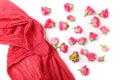 Assorted roses heads and scarf on white background. Overhead view. Flat lay Royalty Free Stock Photo