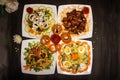 Assorted salads variety with chicken vegetable cashew nut salad, classic Greece salad, russian salad, grilled chicken, munchies,