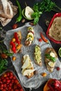 assorted sandwiches stuffed with pÃÂ¢tÃÂ©, avocado, pepper, cherry tomato, mozzarella cheese, vegetables Royalty Free Stock Photo