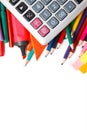 Assorted school supplies, including pens, pencils, scissors, glue and a ruler, on a white background Royalty Free Stock Photo