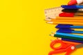 Assorted school supplies on a yellow background Royalty Free Stock Photo