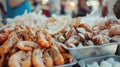 Assorted seafood with shrimps and shells on display at market Royalty Free Stock Photo