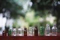 Assorted series collection of empty transparent glass bottle container in white, green and brown color, container reuse concept Royalty Free Stock Photo