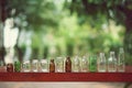 Assorted series collection of empty transparent glass bottle container in white, green and brown color, container reuse concept Royalty Free Stock Photo