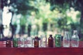 Assorted series collection of empty transparent glass bottle container in white, green and brown color, container reuse concept Royalty Free Stock Photo