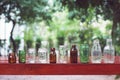 Assorted series collection of empty transparent glass bottle container in white, green and brown color, container reuse concept Royalty Free Stock Photo
