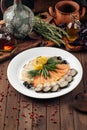 Assorted smoked fish platter on wooden background Royalty Free Stock Photo