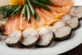 Assorted smoked fish platter on wooden background Royalty Free Stock Photo