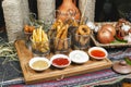 Assorted snacks on the company in the oriental style - onion rings, sausages on skewers Royalty Free Stock Photo