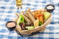 Assorted snacks like deep fried fish, mozzarella sticks, rye bread crouton and glass of beer on the table Royalty Free Stock Photo