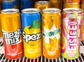 Assorted soft drink cans display on refrigerator shelf Royalty Free Stock Photo