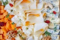 Assorted sorts of cheese on a plate, top view Royalty Free Stock Photo