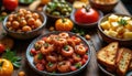 Assorted spanish tapas platter with olives, shrimp, cheese cubes, bread slices. Appetizers arranged invitingly for sharing, Royalty Free Stock Photo