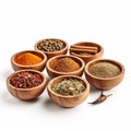 Assorted Spices In Wooden Bowls With Peppercorns And Cinnamon Sticks Royalty Free Stock Photo