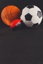 Assorted sport balls on black background Royalty Free Stock Photo