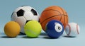 Assorted Sport Balls Grouped on Light Blue Background Royalty Free Stock Photo