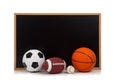 Assorted sports balls with a chalkboard background Royalty Free Stock Photo