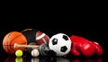 Assorted sports equipment on black Royalty Free Stock Photo