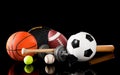 Assorted sports equipment on black Royalty Free Stock Photo