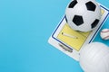 Assorted sports equipment on a blue background with copy space