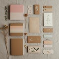 Assorted stationery items are arranged on a fabric surface. These include notebooks Royalty Free Stock Photo