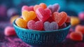 Assorted sugar-coated, heart-shaped candies in turquoise bowl against blurred background, embodying sweet Valentine\'s charm