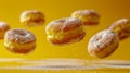Assorted Sugared Donuts Levitating Against Vibrant Yellow Background with Dynamic Motion Blur Effect
