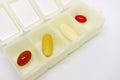 Assorted Supplement Pills in an Opened Daily Pill Organizer Case Royalty Free Stock Photo