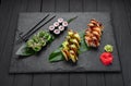 Assorted sushi nigiri and maki big set on slate. A variety of Japanese sushi with tuna, crab, salmon, eel and rolls Royalty Free Stock Photo