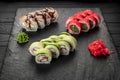 Assorted sushi nigiri and maki big set on slate. A variety of Japanese sushi with tuna, crab, salmon, eel and rolls Royalty Free Stock Photo