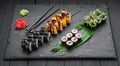 Assorted sushi nigiri and maki big set on slate. A variety of Japanese sushi with tuna, crab, salmon, eel and rolls Royalty Free Stock Photo