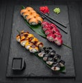 Assorted sushi nigiri and maki big set on slate. A variety of Japanese sushi with tuna, crab, salmon, eel and rolls Royalty Free Stock Photo