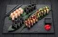 Assorted sushi nigiri and maki big set on slate. A variety of Japanese sushi with tuna, crab, salmon, eel and rolls Royalty Free Stock Photo