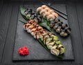 Assorted sushi nigiri and maki big set on slate. A variety of Japanese sushi with tuna, crab, salmon, eel and rolls Royalty Free Stock Photo