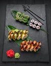 Assorted sushi nigiri and maki big set on slate. A variety of Japanese sushi with tuna, crab, salmon, eel and rolls Royalty Free Stock Photo