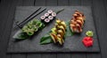 Assorted sushi nigiri and maki big set on slate. A variety of Japanese sushi with tuna, crab, salmon, eel and rolls Royalty Free Stock Photo