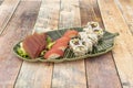 Assorted sushi platter with bluefin tuna nigiri, fresh bluefin tuna sashimi, uramaki california roll with avocado Royalty Free Stock Photo