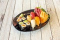 Assorted sushi platter with maki stuffed with rice and avocado, red tuna nigiri, cooked shrimp, nori seaweed and butterfish, Royalty Free Stock Photo