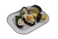 Assorted Sushi rolls (Japanese sushi food) on an iron plate isolated on white background with clipping path Royalty Free Stock Photo
