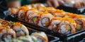 Assorted sushi rolls in takeout containers Royalty Free Stock Photo