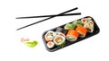 Assorted sushi set in box tray with black bamboo chopsticks isolated on white Royalty Free Stock Photo