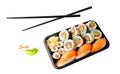 Assorted sushi set in box tray with black bamboo chopsticks isolated on white background Royalty Free Stock Photo