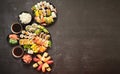 Assorted sushi set served on dark dark background. Top view of seafood, various maki rolls Royalty Free Stock Photo