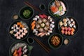 Assorted sushi set served on dark stone slate background. Top view Royalty Free Stock Photo