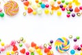 Assorted sweets and lollipop on white background top view space for text Royalty Free Stock Photo