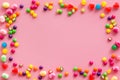 Assorted sweets and marmalade frame on pink background top view space for text Royalty Free Stock Photo